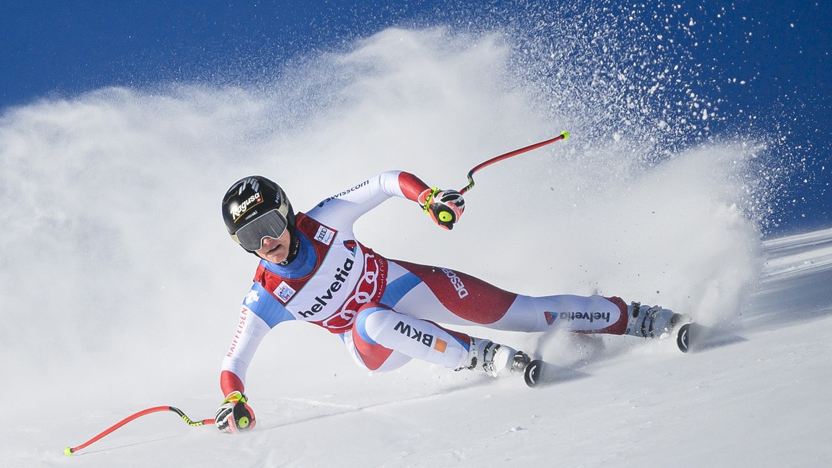 epa09637786 Lara Gut-Behrami of Switzerland in action during the women's Super-G race at the FIS Alpine Skiing World Cup event in St. Moritz, Switzerland, 12 December 2021. EPA/JEAN-CHRISTOPHE BO ...