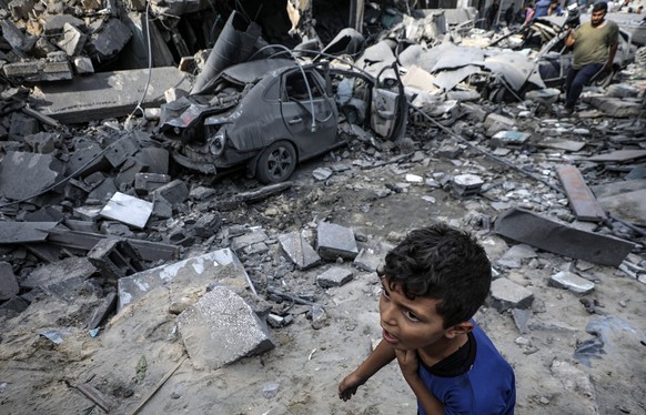 epa10909353 A Palestinian child walks past the rubble of a destroyed area after Israeli air strikes in Gaza City, 09 October 2023. The Israeli army announced on 09 October, it carried out over 500 str ...