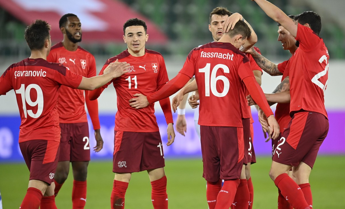 epa09109379 Switzerland's Ruben Vargas (3-L) celebrates with teammates after scoring the 2-2 equalizer during the International Friendly soccer match between Switzerland and Finland in St. Gallen ...
