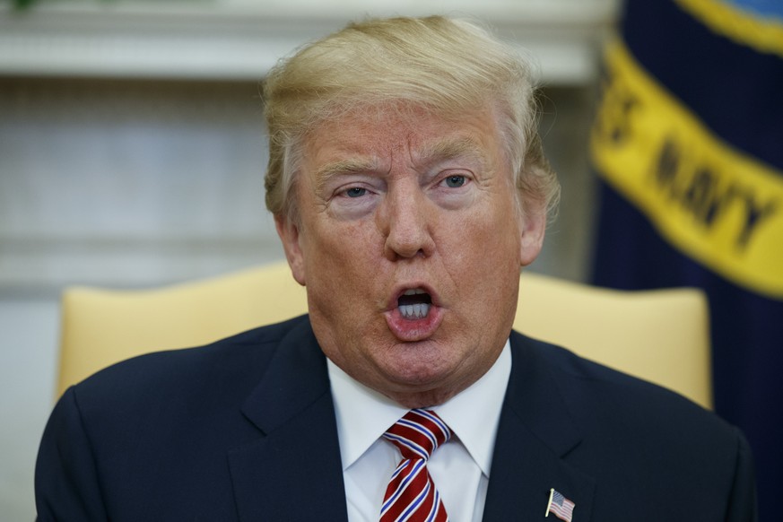 President Donald Trump speaks during a meeting with campaign volunteer Shane Bouvet, in the Oval Office of the White House, Friday, Feb. 9, 2018, in Washington. (AP Photo/Evan Vucci)