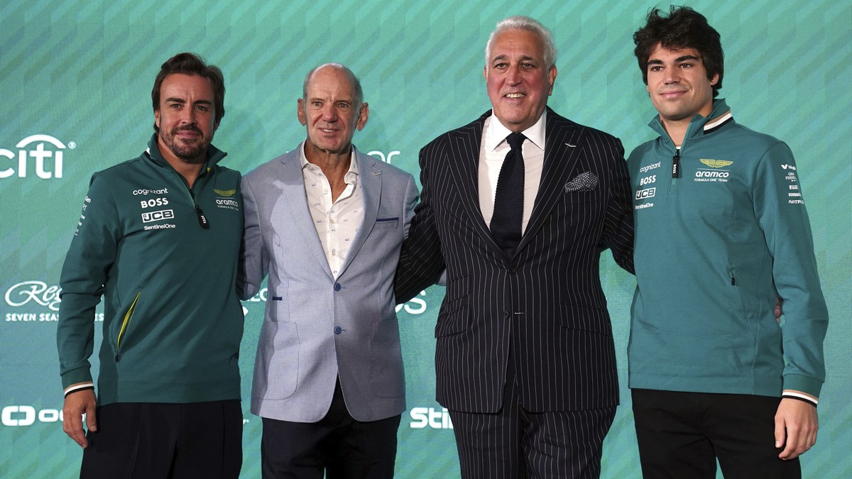 Aston Martin Aramco Formula One Team drivers, Fernando Alonso, left, and Lance Stroll, right, pose with Adrian Newey, second left, newly appointed managing technical partner and Lawrence Stroll, secon ...
