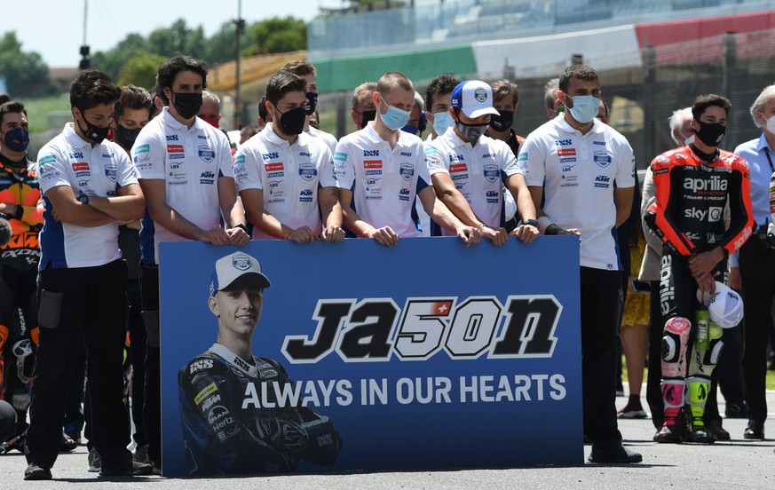 epaselect epa09236737 MotoGP riders and teams line up for one minute of silence in memory of Swiss Moto3 rider Jason Dupasquier, who died in an accident during qualifying, during the Motorcycling Gran ...