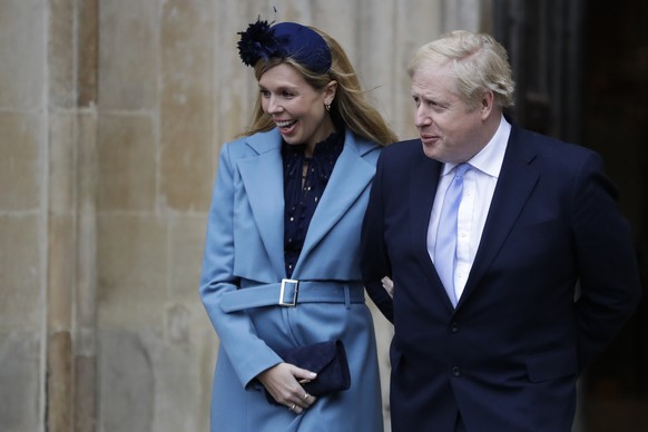 FILE - In this Monday, March 9, 2020 file photo Britain&#039;s Prime Minister Boris Johnson and his partner Carrie Symonds arrive to attend the annual Commonwealth Day service at Westminster Abbey in  ...