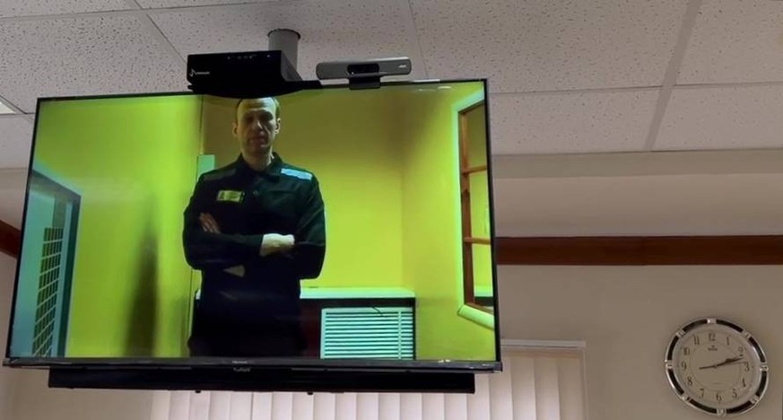 Russia Navalny New Case Trial 8445689 31.05.2023 In this handout video grab released by the Moscow city court, Russian opposition figure Alexei Navalny is seen on a screen via video link from a penal ...