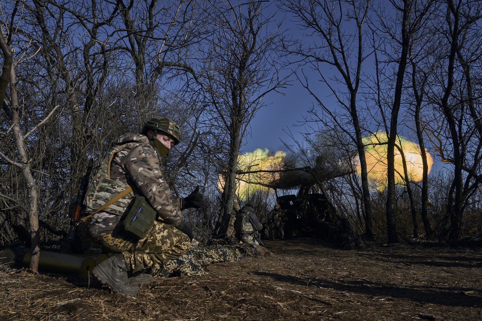 Ukrainian soldiers fire at the Russian positions in the frontline close to Bakhmut, Donetsk region, Ukraine, Wednesday, Feb. 8, 2023. (AP Photo/Libkos)