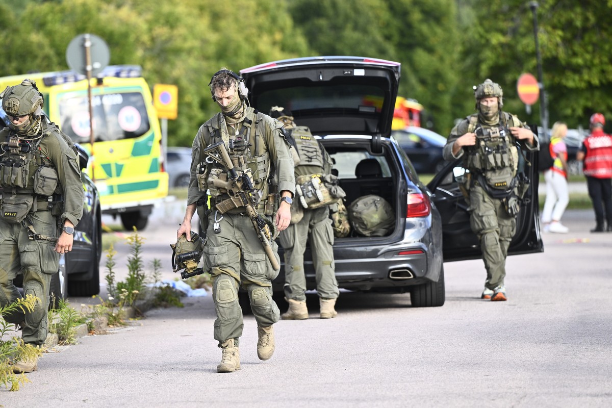 Police and emergency personnel outside Brinellskolan during a major emergency response after a man with a sword reportedly injured several people at the school in Fagersta, Sweden, Friday, Aug. 21, 20 ...