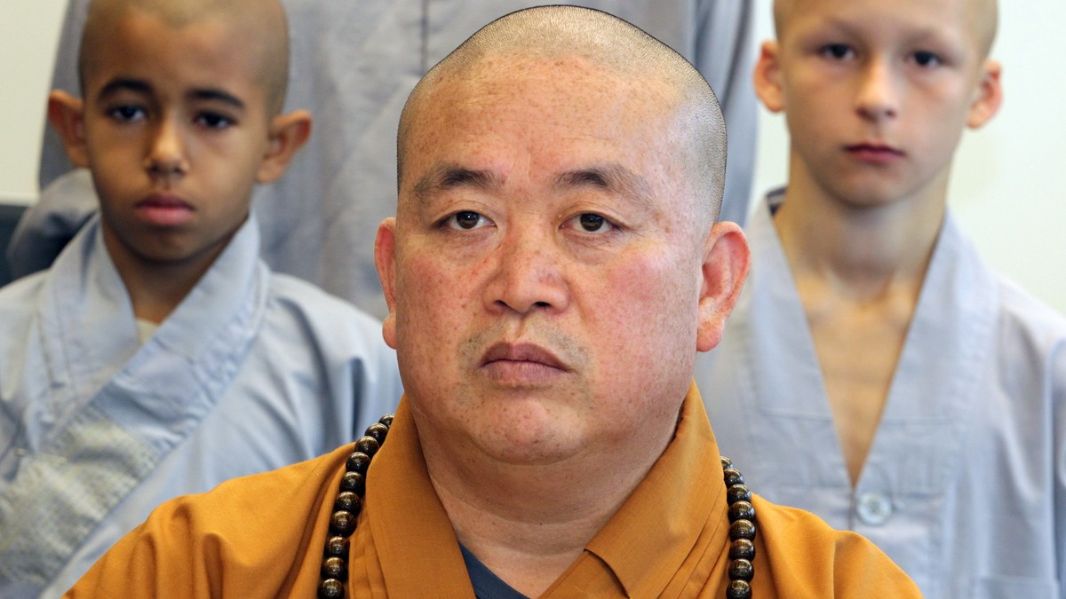 epa12267503 (FILE) - Shi Yongxin (front), abbot of the Chinese Shaolin temple in Henan, speaks at a press conference held at the Chinese Culture Centre in Berlin, Germany, 07 September 2012 (reissued  ...
