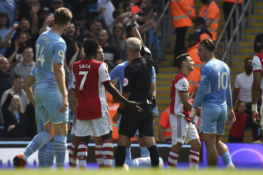 Arsenal&#039;s Granit Xhaka sees the red card during the English Premier League soccer match between Manchester City and Arsenal at Etihad stadium in Manchester, England, Saturday, Aug. 28, 2021. (AP  ...