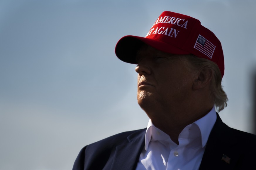 Former President Donald Trump watches a video clip of President Joe Biden during a campaign rally for Nebraska Republican gubernatorial candidate Charles Herbster, Sunday, May 1, 2022, in Greenwood, N ...