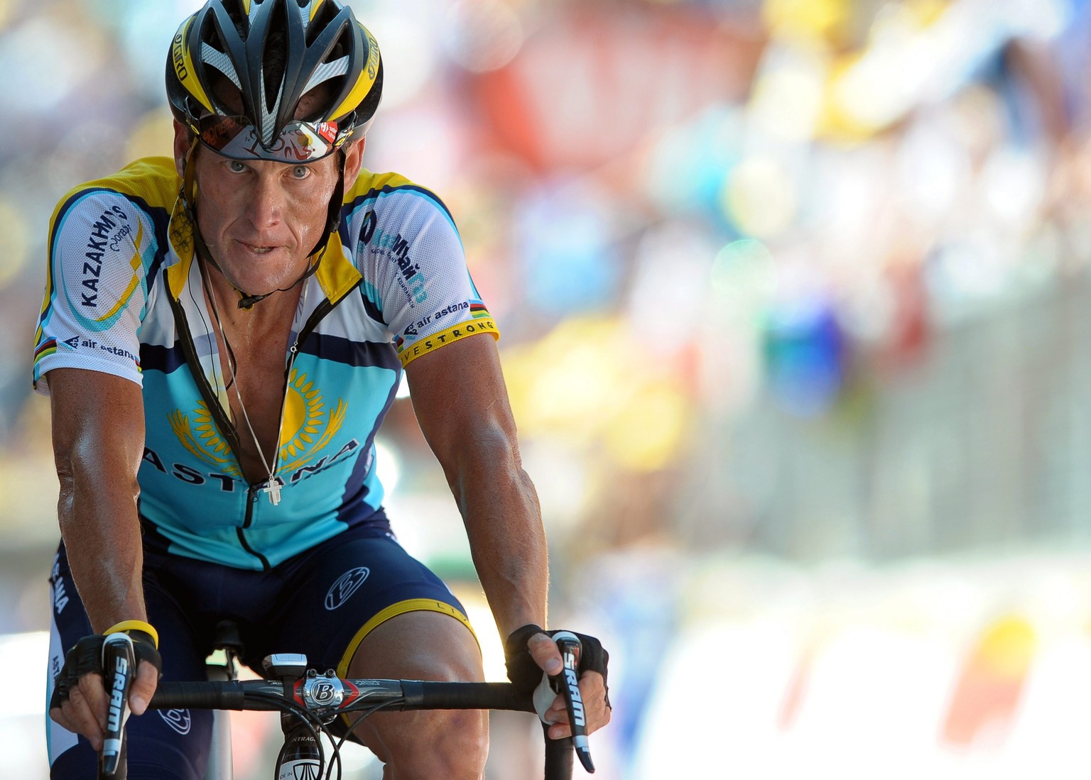 epa04622988 (FILE) A file picture dated 19 July 2009 of US rider Lance Armstrong of the Astana team crossing the finish line of the 15th stage of the Tour de France cycling race between Pontarlier and ...