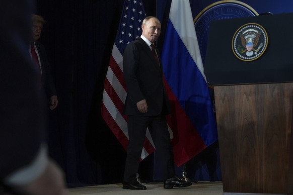 President Donald Trump, left, and Russia&#039;s President Vladimir Putin arrive for a press conference at Joint Base Elmendorf- Richardson, Friday, Aug. 15, 2025, in Anchorage, Alaska. (AP Photo/Julia ...