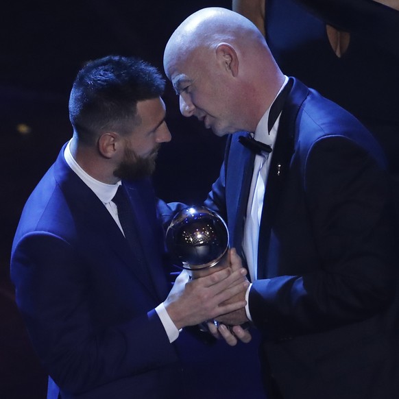Argentinian Barcelona player Lionel Messi receives the Best FIFA mens player award from FIFA president Gianni Infantino during the ceremony of the Best FIFA Football Awards, in Milan's La Scala t ...