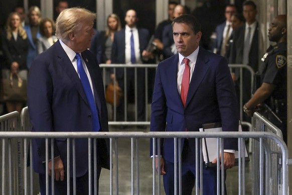 Former president Donald Trump, left, speaks after leaving the courtroom at Manhattan criminal court, Monday, April 22, 2024, in New York. Opening statements in Trump&#039;s historic hush money trial a ...