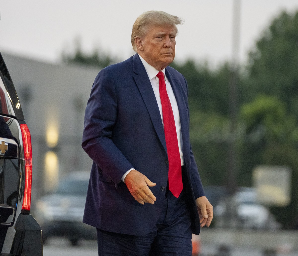 Former President Donald Trump walks to speak with reporters before departure from Hartsfield-Jackson Atlanta International Airport, Thursday, Aug. 24, 2023, in Atlanta. (AP Photo/Alex Brandon)
Donald  ...