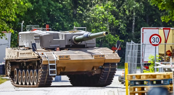 epa10676433 A German main battle tank Leopard drives around the factory site of Rheinmetall AG in Unterluess, Germany, 06 June 2023. Rheinmetall produces large-caliber weapons and ammunition for tanks ...