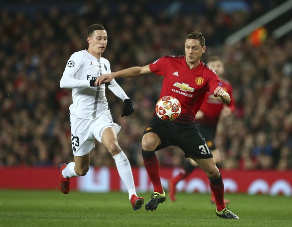 Manchester United&#039;s Nemanja Matic, right vies for the ball with Paris Saint Germain&#039;s Julian Draxler during the Champions League round of 16 soccer match between Manchester United and Paris  ...