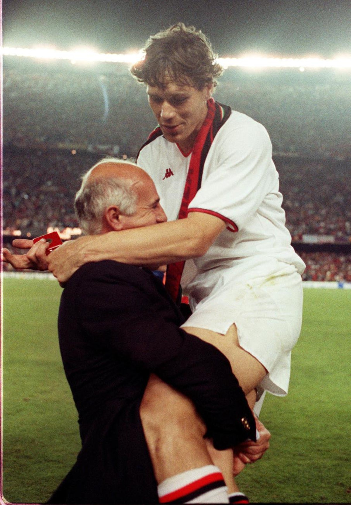 AC Milan former coach Arrigo Sacchi is embraced by Dutch forward Marco Van Basten after beating Steaua Bucarest in the Cup of Champions final in Barcelona, Spain, on May 1989. AC Milan is celebrating  ...