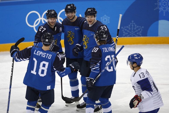 Petri Kontiola (27), of Finland, celebrates with his teammates after scoring a goal against South Korea during the first period of the qualification round of the men&#039;s hockey game at the 2018 Win ...