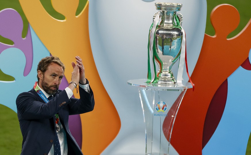 England&#039;s manager Gareth Southgate gestures to the crowd after receiving his runner-up medal following their loss to Italy in the Euro 2020 soccer championship final at Wembley stadium in London, ...