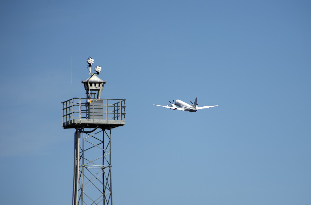 In this April 2015 photo provided by Saab AB, a plane takes off beyond a remotely controlled control tower at Ornskoldsvik Airport in northern Sweden. The dozen commercial planes that land here each d ...