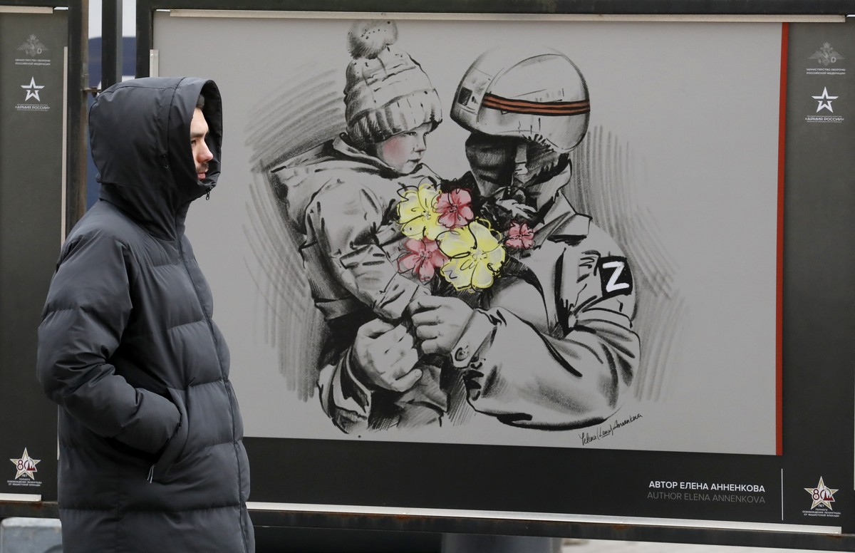 epa11228026 Pictures by various Russian artists are on display at the street military exhibition 'We bring Peace' in St. Petersburg, Russia, 18 March 2024. Later today, a rally and a concert ...