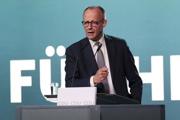 epa12782051 German Chancellor Friedrich Merz delivers a speech during a campaign event of the Christian Democratic Union (CDU) party for the state election of Hesse in Volkmarsen, Germany, 27 February ...