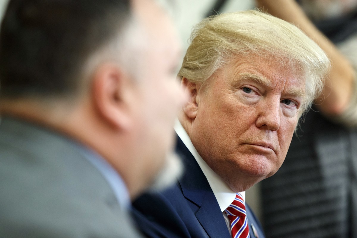 President Donald Trump listens as Don Bouvet speaks in the Oval Office of the White House, Friday, Feb. 9, 2018, in Washington. Trump gifted $10,000 to Bouvet's son Shane, a campaign volunteer, a ...