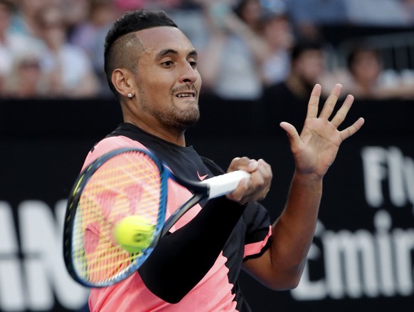 Australia&#039;s Nick Kyrgios makes a forehand return to Serbia&#039;s Viktor Troicki during their second round match at the Australian Open tennis championships in Melbourne, Australia, Wednesday, Ja ...