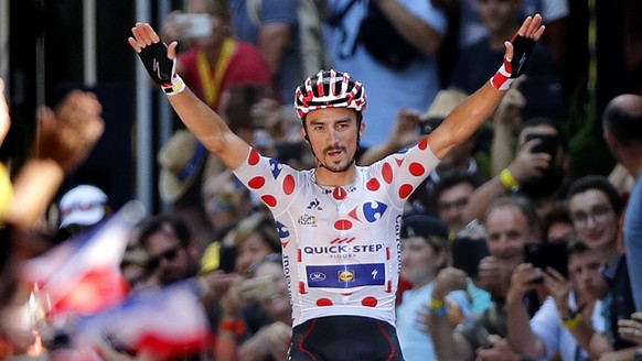 epa06908147 Quick Step Floors rider Julian Alaphilippe of France celebrates as he crosses the finish line to win the 16th stage of the 105th edition of the Tour de France cycling race over 218km betwe ...