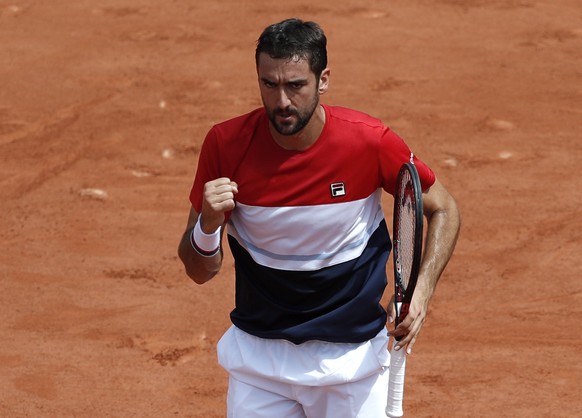 epa06790604 Marin Cilic of Croatia reacts as he plays Juan Martin Del Potro of Argentina during their menâs quarter final match during the French Open tennis tournament at Roland Garros in Paris, Fr ...