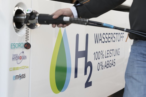 Mr. Senn fills up a hydrogen fuel cell truck at the Coop hydrogen filling station in Hunzenschwil November 3, 2016. The Coop hydrogen filling station is the first public ...