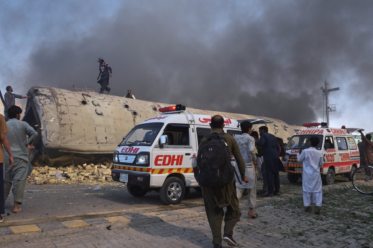 Volunteers look for victims from an overturned train coach on a railway track at the site of a bomb explosion in Quetta, Pakistan, Sunday, May 24, 2026. (AP Photo/Arshad Butt)
Pakistan Train Bombing