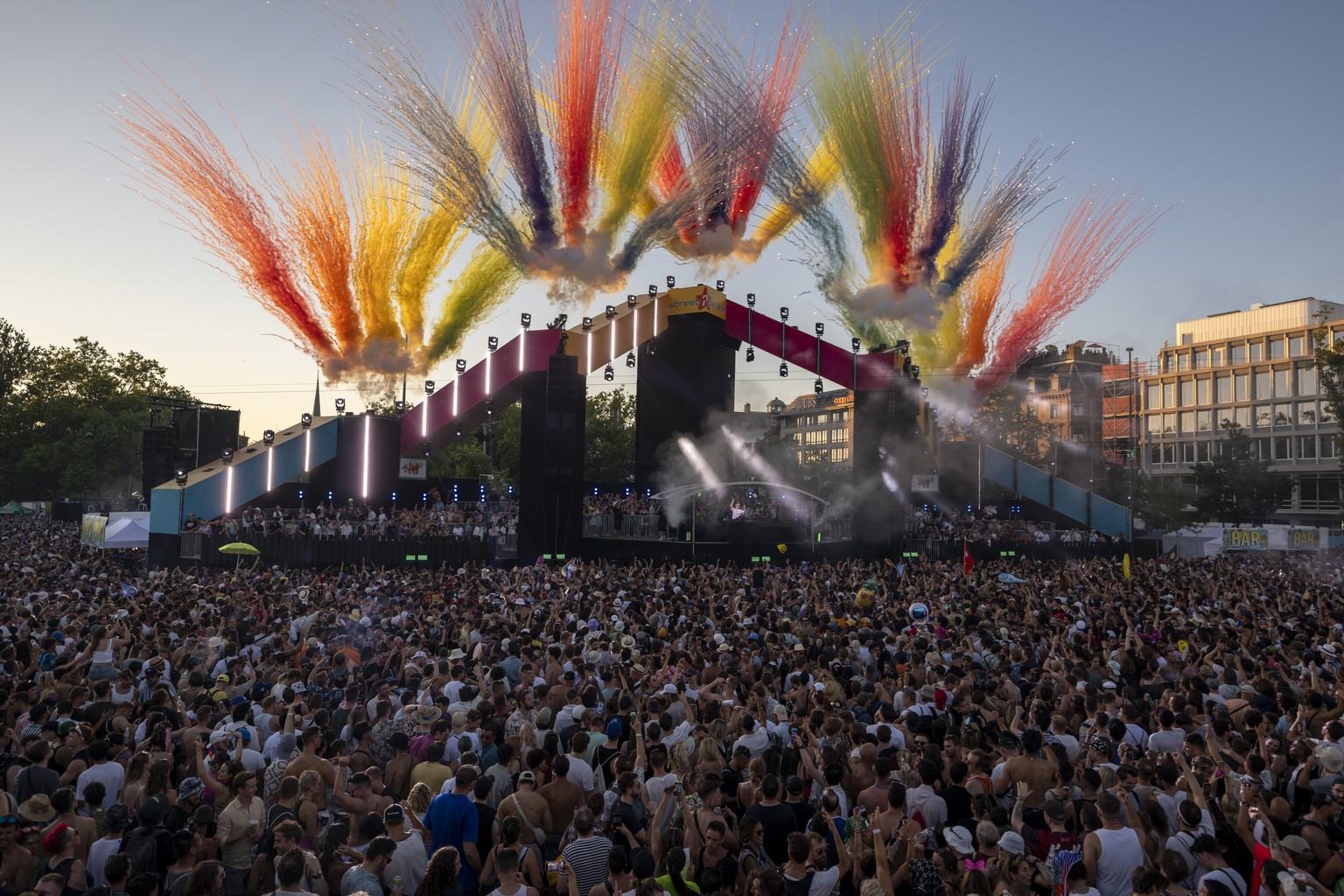 Thousands of participants dancing through the streets during the 31th Street Parade in the city center of Zurich, Switzerland, Saturday, August 10, 2024. The annual dance music event Street Parade run ...