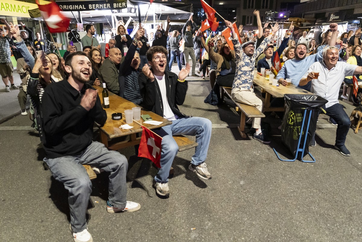 epa11334444 Supporters of singer Nemo, finalist of the 68th Eurovision Song Contest ESC, celebrate during a public viewing watching the broadcast of the ESC finals as Nemo is declared winner of the co ...