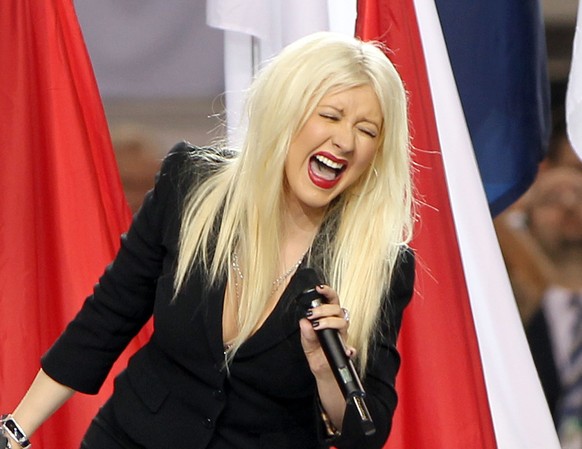 ARLINGTON, TX - FEBRUARY 06: Singer Christina Aguilera performs during the Bridgestone Super Bowl XLV Pregame Show at Dallas Cowboys Stadium on February 6, 2011 in Arlington, Texas. (Photo by Christop ...