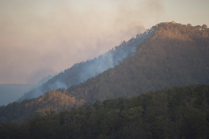 epa07826957 Smoke rises from bushland at Sarabah above the Lamington National Park Road, Canungra, Queensland, Australia, 07 September 2019 (issued 08 September 2019). A number of homes have been dest ...