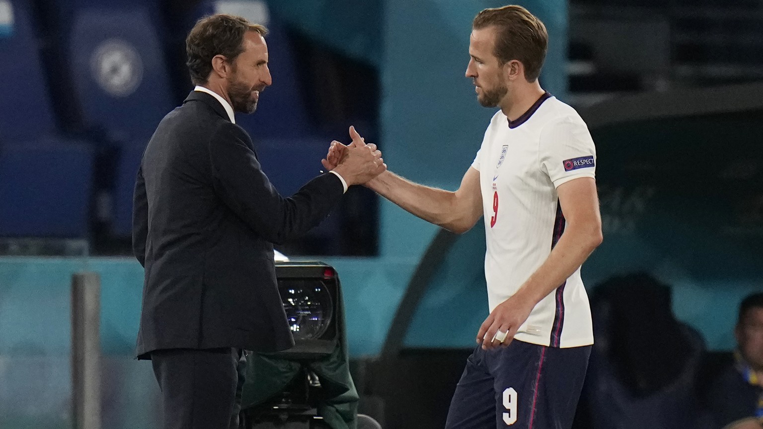 England&#039;s manager Gareth Southgate, left, and Harry Kane shake hands during the Euro 2020 soccer championship quarterfinal match between Ukraine and England at the Olympic stadium in Rome at the  ...