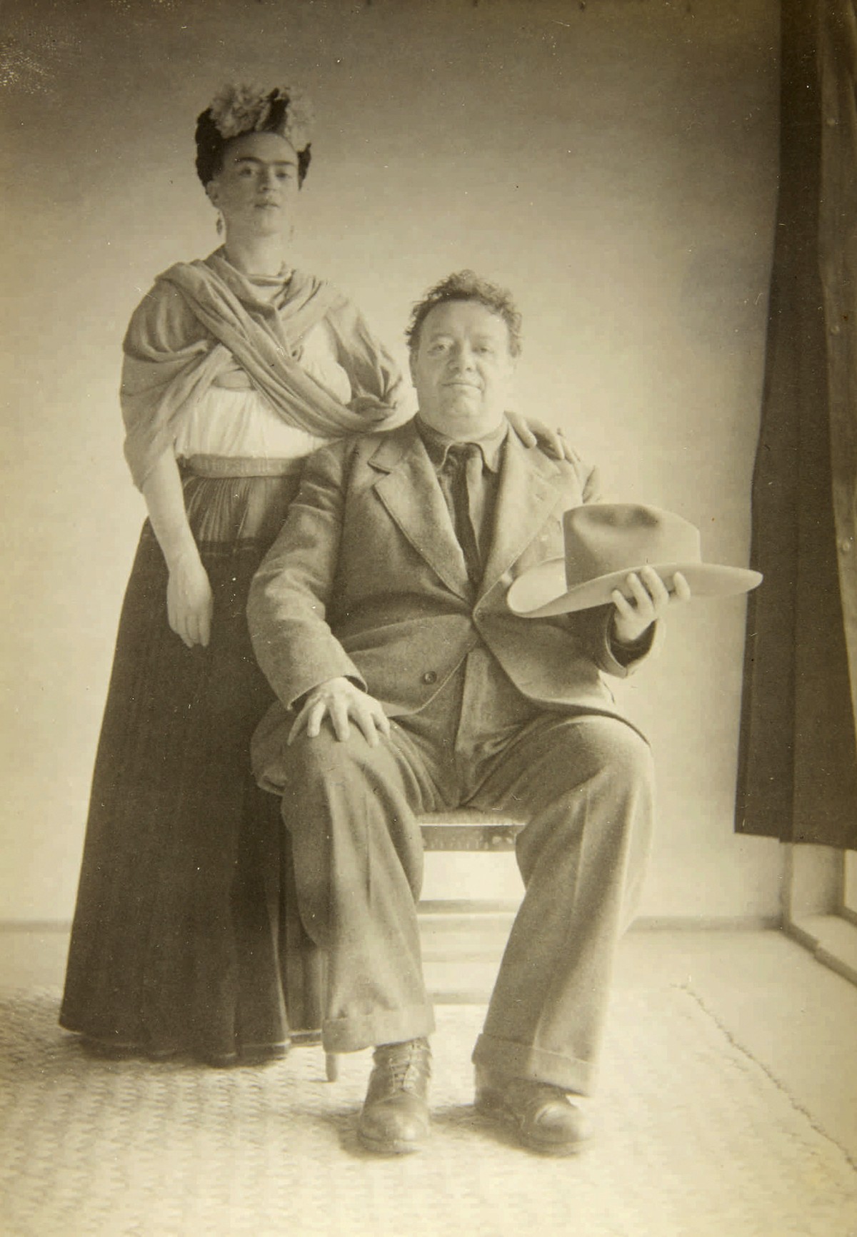 In this 1940 photo provided by Sotheby's, artists Frida Kahlo and Diego Rivera pose for a portrait. The image is part of a collection of photographs by Nicholas Muray up for auction on Friday, Ap ...