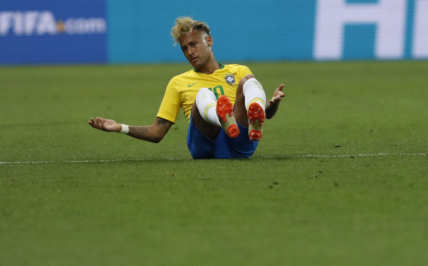 Brazil's Neymar lies on the ground during the group E match between Brazil and Switzerland at the 2018 soccer World Cup in the Rostov Arena in Rostov-on-Don, Russia, Sunday, June 17, 2018. (AP Ph ...