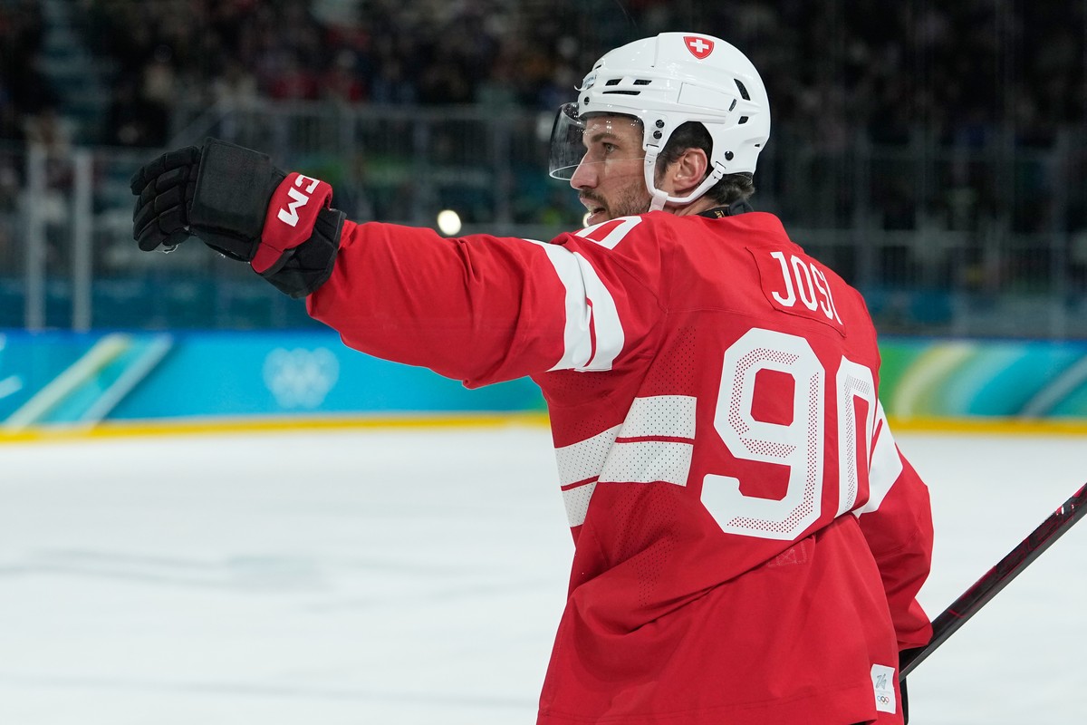 Switzerland's Roman Josi celebrates after scoring his sides second goal during a men's ice hockey qualification playoff game between Switzerland and Italy at the 2026 Winter Olympics, in Mil ...