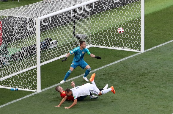 epa06855021 Goalkeeper Igor Akinfeev of Russia is beaten by an own goal of his teammatee Sergei Ignashevich (white shirt) during the FIFA World Cup 2018 round of 16 soccer match between Spain and Russ ...