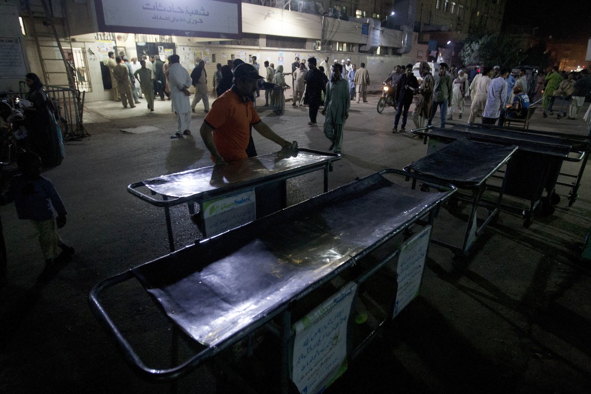 Pakistani hospital staff make arrangements outside an emergency ward for the victims of suicide bombing at a famous shrine in interior Sind province, in Karachi, Pakistan. Thursday, Feb. 16, 2017. An  ...