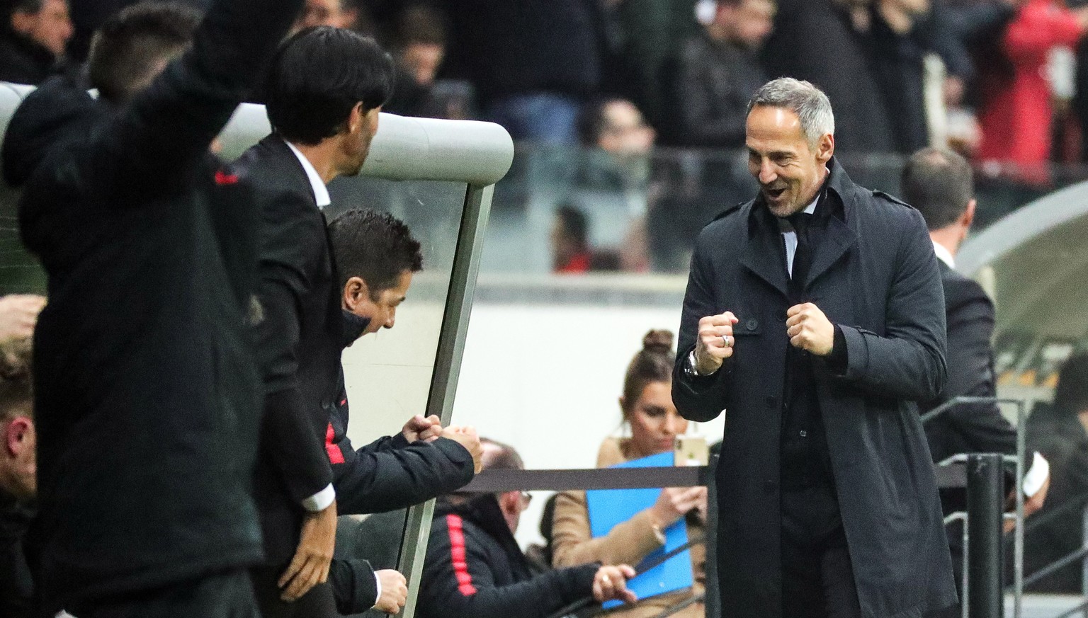 epa07386124 Frankfurt&#039;s head coach Adi Huetter (R) celebrates after the UEFA Europa League round of 32, second leg soccer match between Eintracht Frankfurt and Shakhtar Donetsk in Frankfurt Main, ...