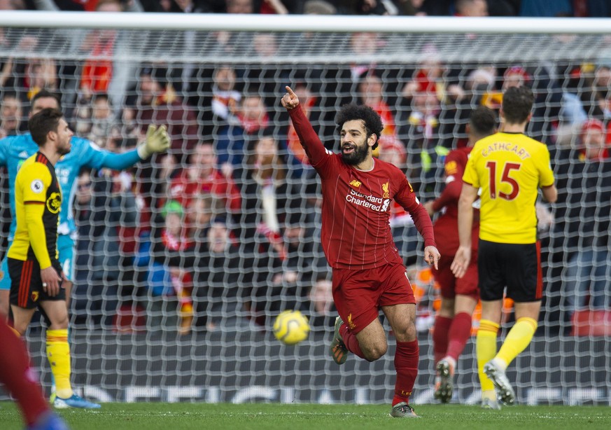 epa08070859 Liverpool&#039;s Mohamed Salah celebrates scoring the first goal during the English Premier League soccer match between Liverpool and Watford held at the Anfield in Wolverhampton, Britain, ...
