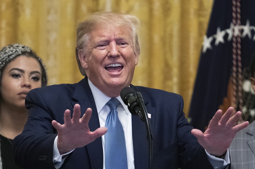 President Donald Trump speaks at the Young Black Leadership Summit 2019 in the East Room of the White House in Washington, Friday, Oct. 4, 2019. Kearyn Bolin, back left, of Texas State University list ...