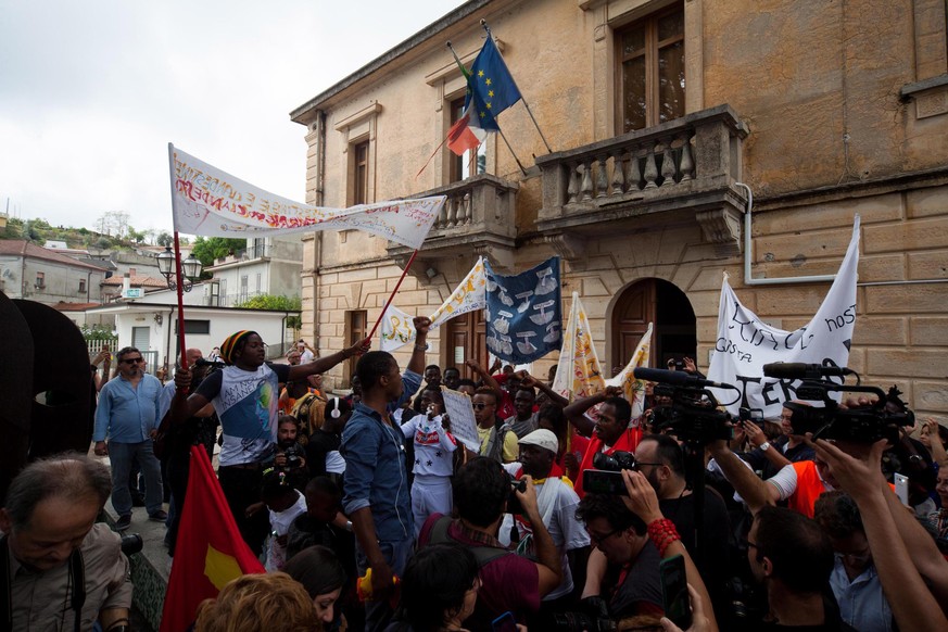 epa07074113 Supporters attend a solidarity demonstration for the Mayor of Riace, Domenico Lucano, in Riace, Calabria region, southern Italy, 06 October 2018. Domenico Lucano was arrested on 02 October ...