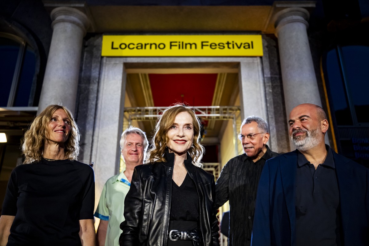 KEYPIX - Actress Isabelle Huppert from France, center, actress Sandrine Kiberlain from France, left, and film director Marc Fitoussi from France, right, arrive at the Piazza Grande square for the scre ...