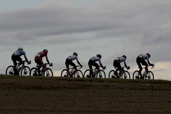 Switzerland&#039;s Michael Schar, right, leads his fellow-countrymen Michael Albasini, Enrico Gasparotto, Marc Hirschi, Denmark&#039;s Niclas Eg and Belgium&#039;s Jasper Steven, during the men&#039;s ...