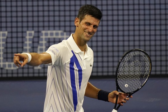 Novak Djokovic, of Serbia, reacts to winning his match over Ricardas Berankis, of Lithuania, during the second round at the Western &amp; Southern Open tennis tournament Monday, Aug. 24, 2020, in New  ...