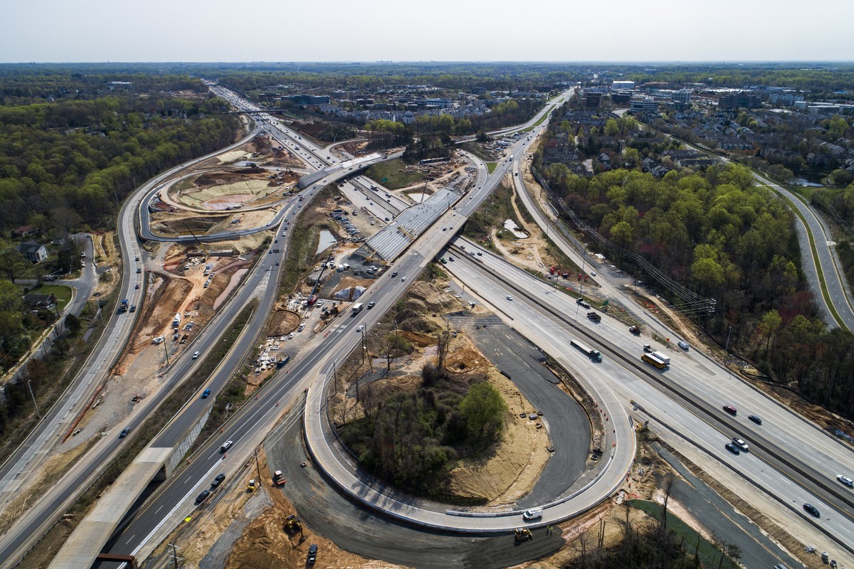 epa09122397 An image made with a drone shows on-going construction at the Route 50 interchange with I-66 in Fairfax, Virginia, USA, 08 April 2021. US President Biden's 2 trillion US dollar infras ...